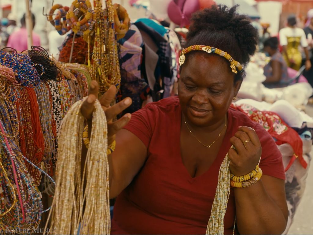 woman selling homemade jewlery ghana